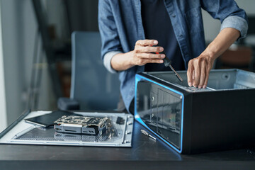 Computer repair technician specialist repairing and testing on Pc.