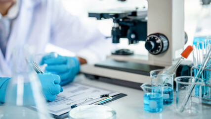 Scientists researching biochemical in a laboratory, Science experiment