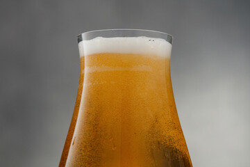 Close up of Beer. Glass of fresh and cold beer with bubbles. Glass of fresh and cold craft beer. Shallow depth of field