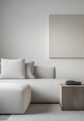 Modern minimalist living room with a textured sofa, decorative cushions, wooden side table, and subtle wall art in soft neutral tones