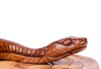 Wooden snake figure isolated on white background. Chinese zodiac concept for new year 2025