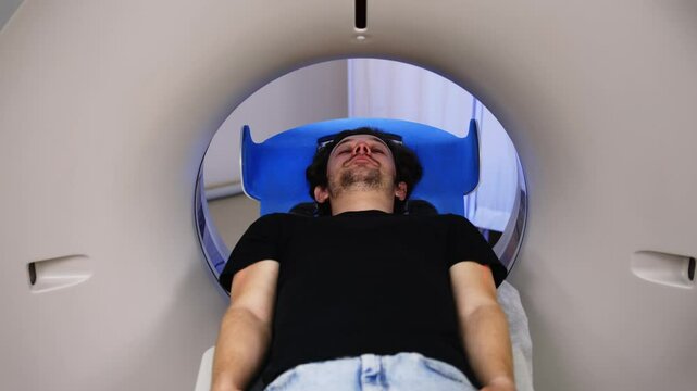 The patient leaves the MRI capsule. Illustrating the work of advanced imaging technologies. This scene emphasizes attention to patient care and the importance of accurate diagnosis.