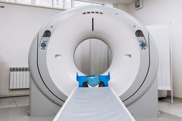 A medical CT or MRI machine is located in a diagnostic clinic, showcasing advanced imaging...