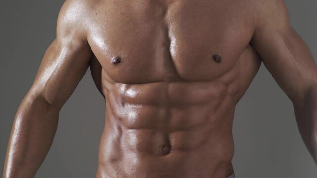 Male chest. Perfect abs, shoulders, and chest. Close up the Abs. Closeup torso. Ab. Muscular chest and ripped abs. Sexy male muscular body. Man with naked torso showing chest and six pack abs.