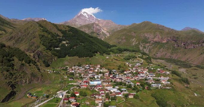 Forward Drone Shot Above Gergeti, Georgian Mountain Village. Mount Kazbek