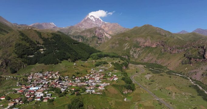 Birds Eye View Above Gergeti Mountain Village in Georgia. Mount Kazbek