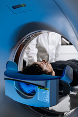 A medical CT or MRI machine is located in a diagnostic clinic, showcasing advanced imaging...