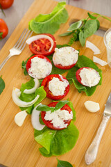 tomato wedges with cottage cheese filling and garlic, spicy appetizer