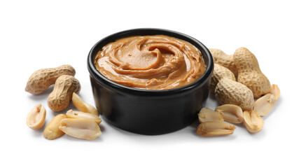 Tasty peanut butter in bowl and groundnuts isolated on white