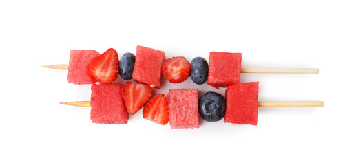 Skewers with tasty watermelon, blueberries and strawberries isolated on white, top view © New Africa