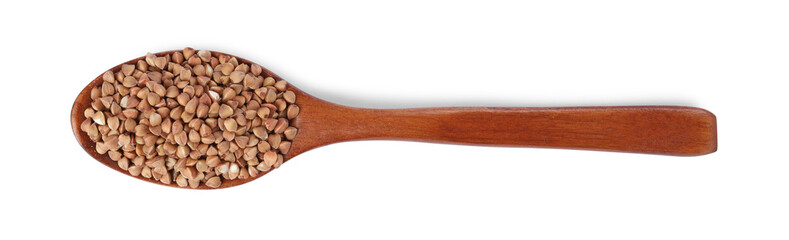 Raw buckwheat in wooden spoon isolated on white, top view