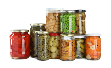 Different pickled products in jars isolated on white