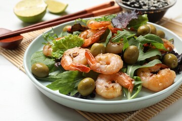 Delicious shrimp salad served on white table, closeup