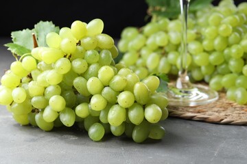 Fresh ripe grapes on grey table, closeup