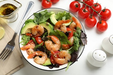 Delicious shrimp salad and ingredients on white table, flat lay