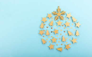 Christmas golden ball, fir trees and stars on a blue background. Place for text. Postcard,...