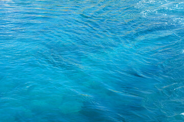 Blue foaming sea water. Natural background