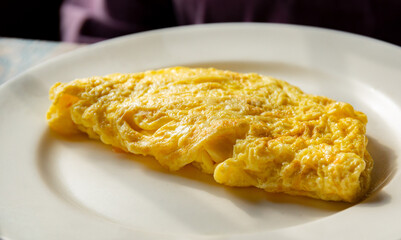 Plain omelette on white plate 