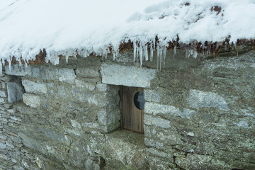Icicles Hanging from a Stone Roof