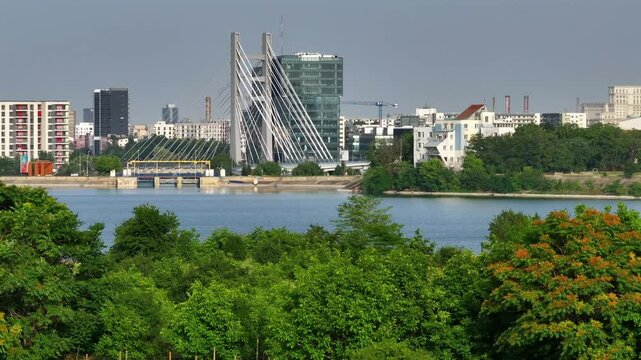 Bucharest from above. Aerial 4K video with Ciurel Bridge and Dambovita River, filmed from Morii Lake. Landmarks and main roads of Bucharest during a summer day.