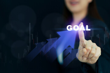 Unrecognizable Asian businesswoman is touching on holographic in the air.