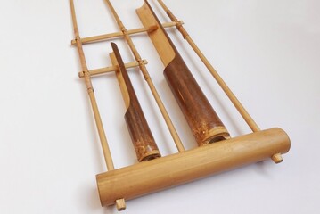 Traditional Indonesian musical instrument made of bamboo called Angklung isolated on white background.