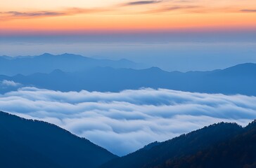 Serene mountain landscape with clouds at sunset.