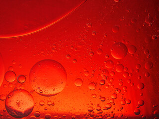 Abstract Background Red oil Macro Colorful artistic of oil drop floating on the water. macro red bubble oil of wallpeper, blood concept