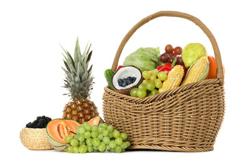 Wicker basket with different fresh vegetables and fruits isolated on white