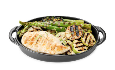 Delicious grilled vegetables and chicken breast in baking dish isolated on white