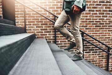 Businessman, legs and walking in city, steps and commute in urban town to workplace. Male person,...