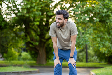 Man engaged in active physical exercises and fitness in the park, showing determination and effort...