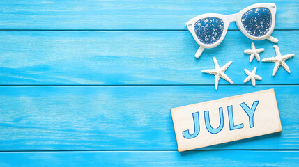 July typography written with wooden letter - new month concept background. 