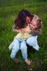 Fototapeta premium mother plays catch up with her daughters
