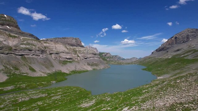 Idyllic Swiss nature scenery. Gemmipass and Daubensee mountain lake. popular for hiking activities in Switzerland, Valais canton, aerial high angle 4k hd video