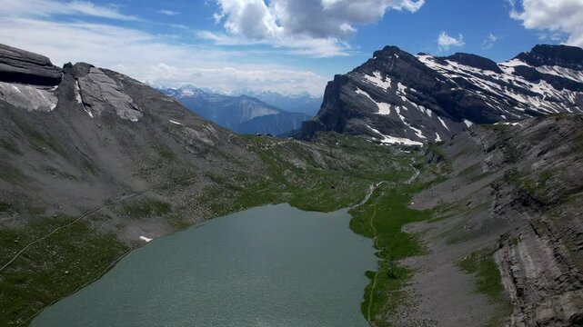 Idyllic  Swiss nature scenery. Gemmipass and Daubensee mountain lake. popular for hiking activities in Switzerland, Valais canton, aerial high angle view