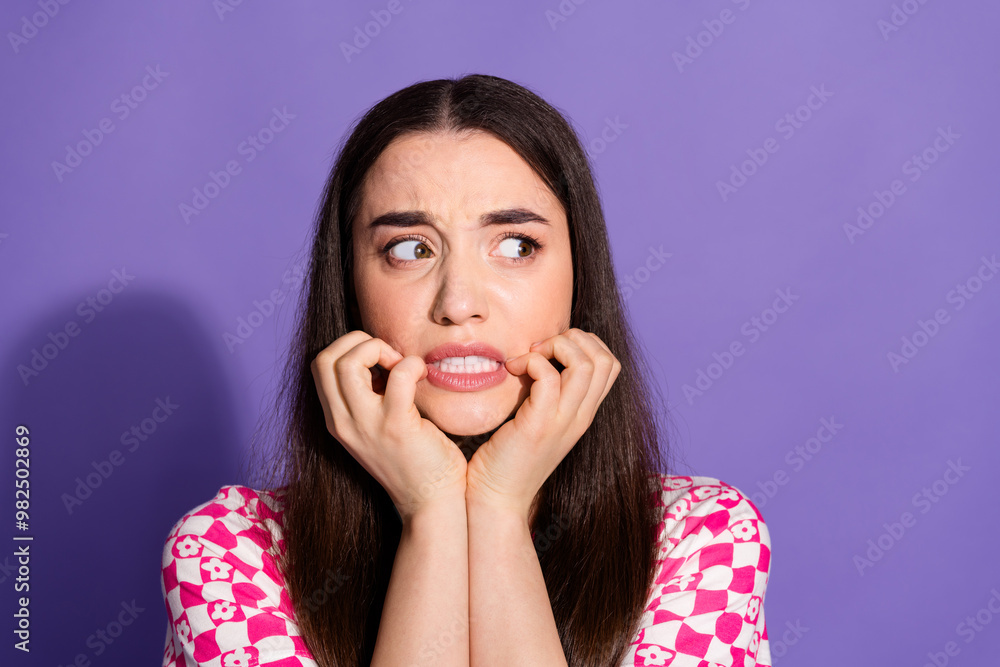 Poster Portrait of nice young woman grin look empty space wear checkered t-shirt isolated on violet color background