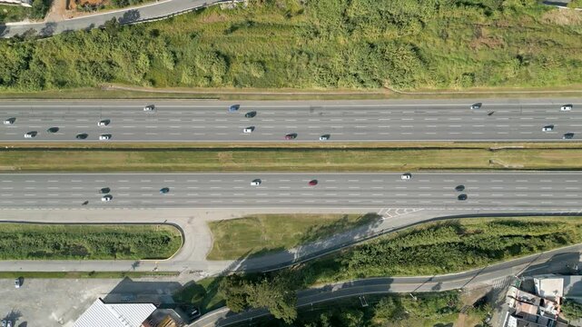 Drone shot of highway top down view follow vehicle aerial footage / Freewayc ars traffic in Brazil

