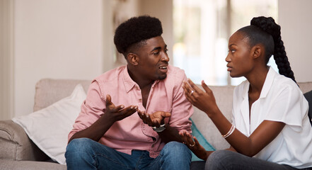 Black couple, argument and fight with disagreement on sofa for dispute, conflict or divorce at...