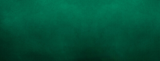 A dark Green, grunge-textured background with a rough, grainy concrete wall surface. Green abstract texture background. empty copy space for text, wall structure, grunge canvas. luxury Blue grunge