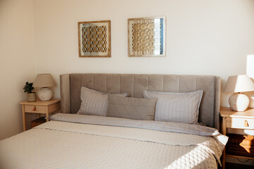 Modern and minimalist bedroom with sunlight shining through window