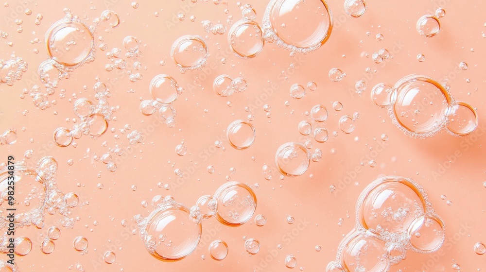 Poster water bubbles clustered in abstract patterns on a pastel peach background.