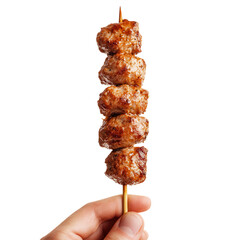 Delicious grilled meat skewer held by a hand, perfect for barbecue lovers and food photography. isolated on a transparent background