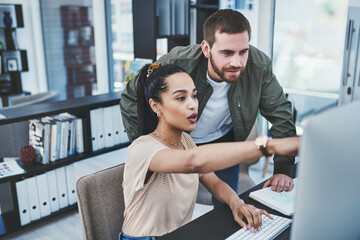 Business, people and pointing to computer in office for internship, schedule advice and article...