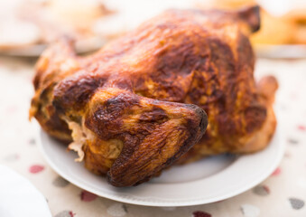 Whole roasted chicken on a plate