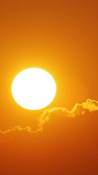 Time lapse of the sun rising behind clouds in Florida