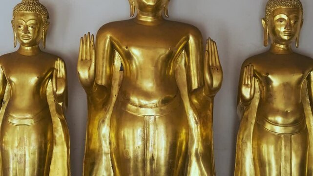 Golden Buddha statues in Wat Pho Temple Complex in Bangkok city, Thailand, Asia. Temple of the Reclining Buddha. Popular tourist landmark