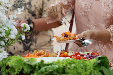 Food Buffet Catering Dining Eating Party Sharing Concept.people group catering buffet food indoor in luxury restaurant with meat colorful fruits and vegetables