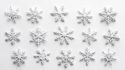 A collection of intricately designed white snowflakes on a light background, perfect for winter-themed projects and decorations.
