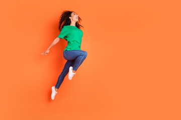 Photo of young funky attractive american girl jumping flying motivated and inspired looking...